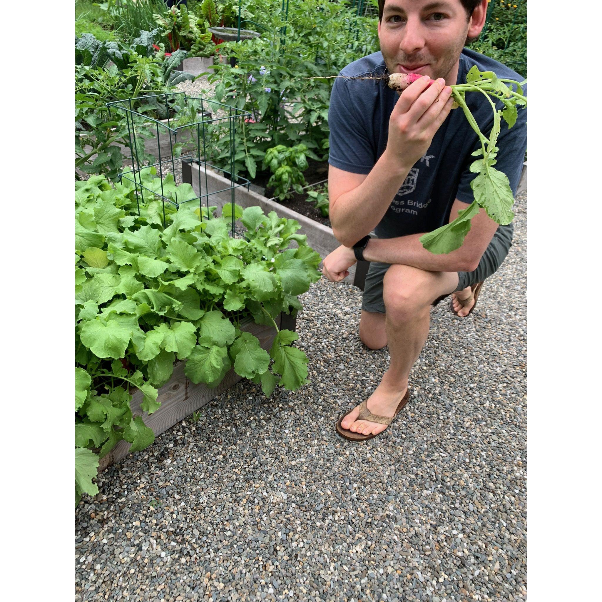 Marc enjoying some garden fresh veggies