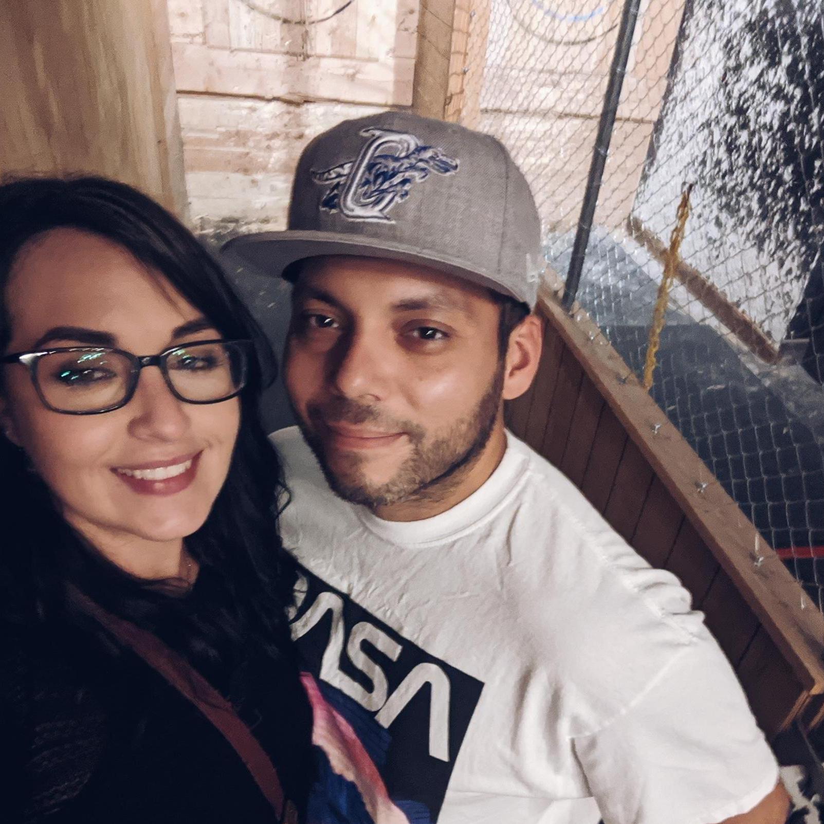 Tanasia attempting to lose gracefully to Octavio at axe throwing....