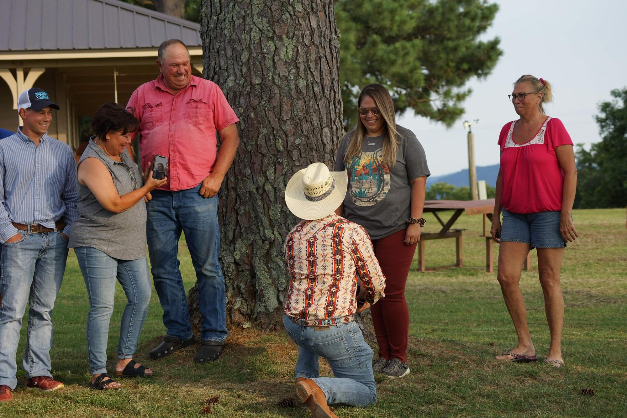 Corey steps out from the "family picture" 
Kara, "What the heck are you doing? You have to be in this dang picture!"
Then what was really happening hit.  Not sure what he said other than "Kara Marley"