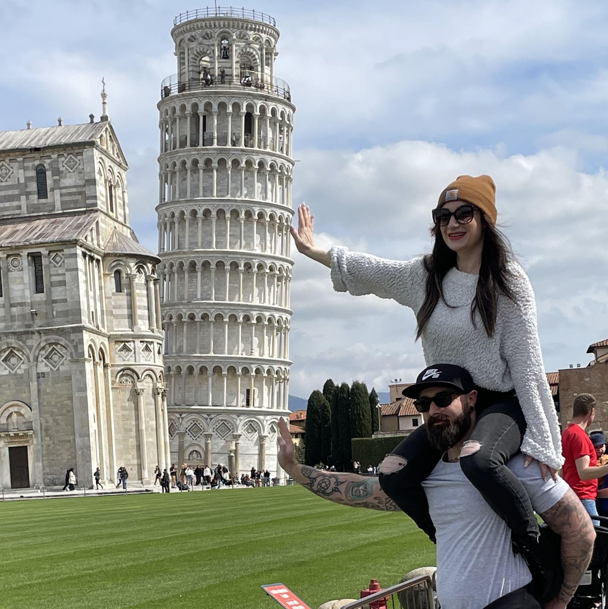 A very bad attempt at holding up the Leaning Tower of Pisa.