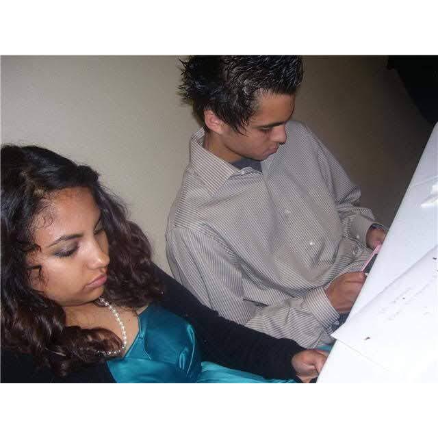 Playing Mario Kart on our Nintendo DS at a party in 2009.