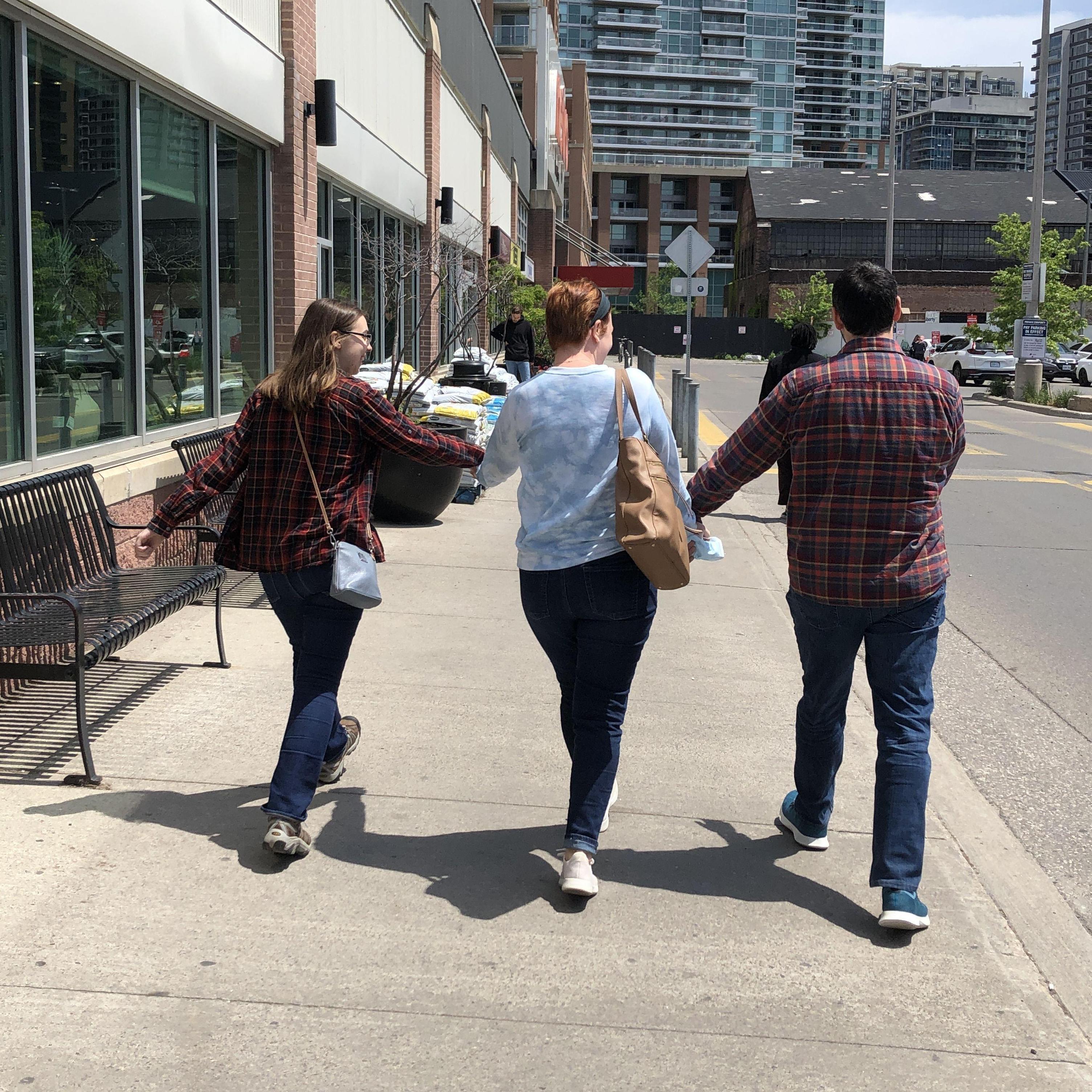 Emily skipping along with Tim and Samantha, May 2022