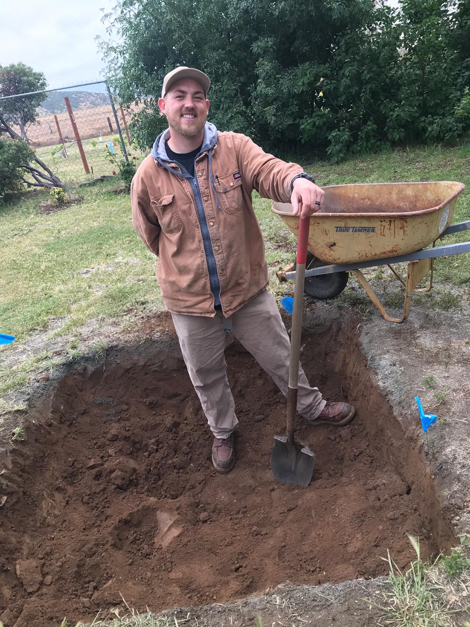 Getting ready for the wedding !! Alex has started digging the imu ( the actual pit we will cook the pig in )