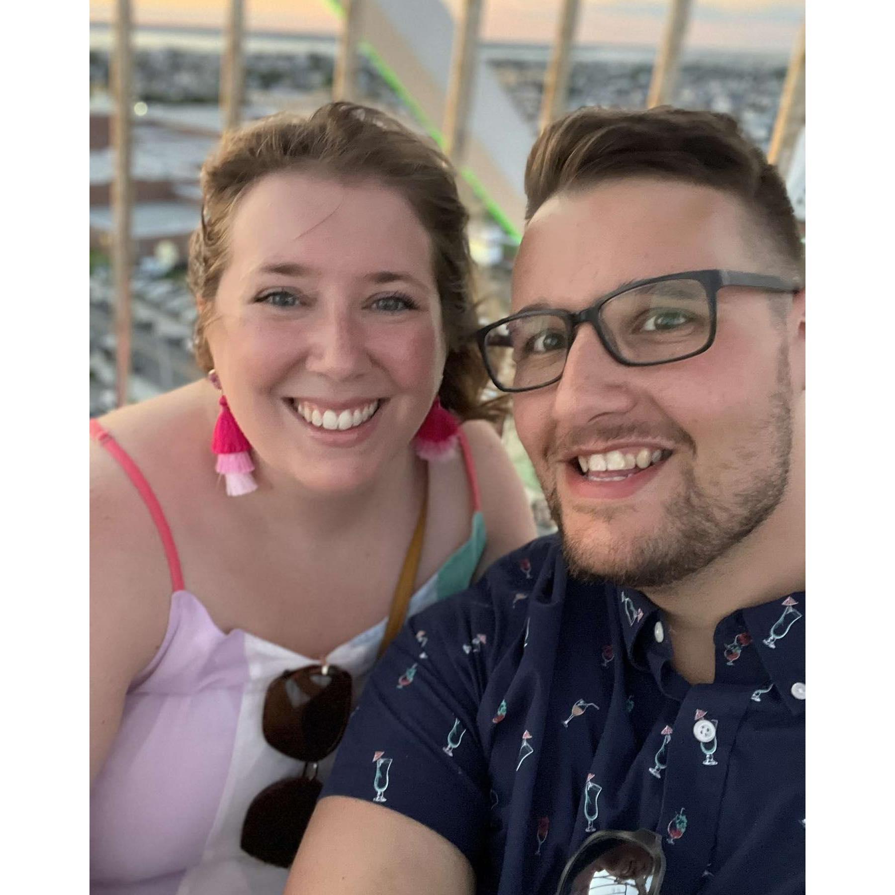 On a ferris wheel at sunset in Ocean City, NJ just before Jeff proposed on the beach.