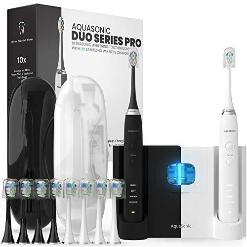 AquaSonic DUO PRO - Dual Handle Ultra Whitening 40,000 VPM Electric Smart ToothBrushes - 4 Modes with Smart Timers - UV Sanitizing & Wireless Charging Base - 10 ProFlex Brush Heads & 2 Travel Cases