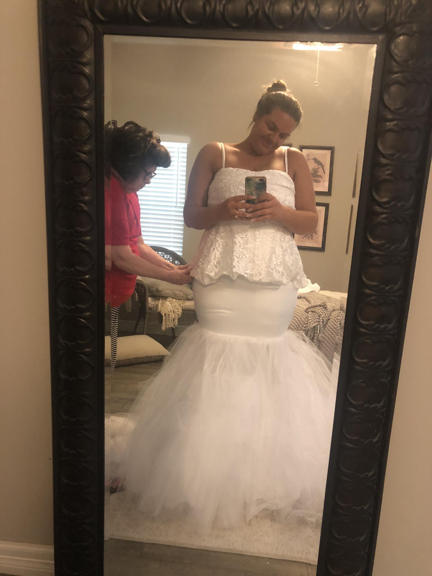Carolines grandmother, Mums, putting last touches on the wedding dress. Such a special special moment- made with LOTS OF LOVE