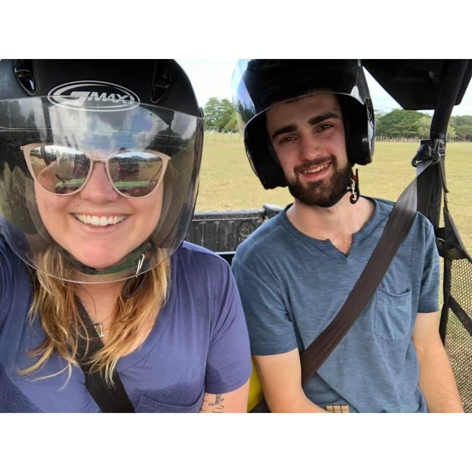 Morgan and Devin Riding around in a UTV.