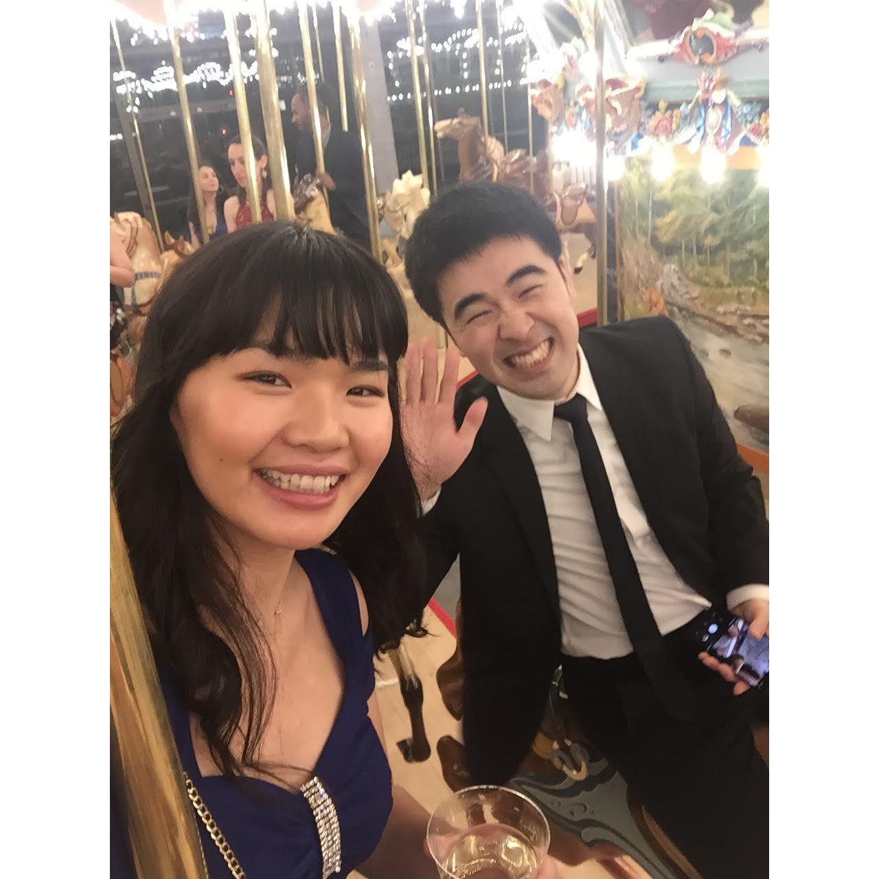 Riding a merry-go-round and sipping on wine at Han Jun's med school Caduceus Ball, 2019. We highly recommend!