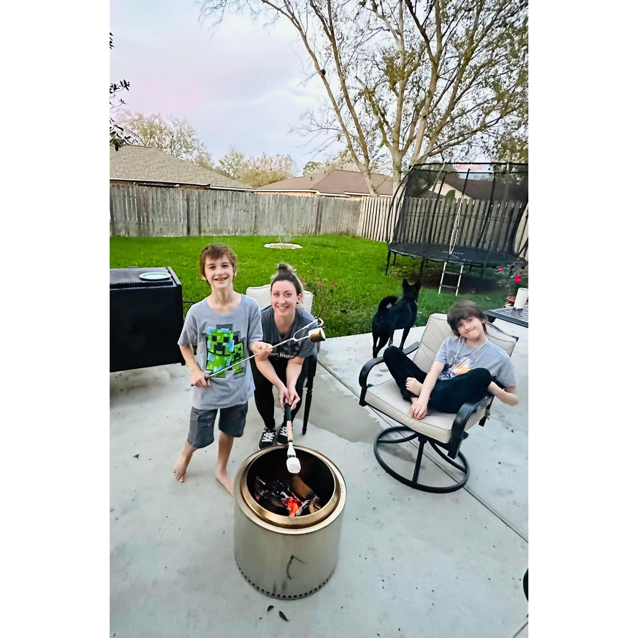 Roasting marshmallows in their backyard is a must every fall season now!