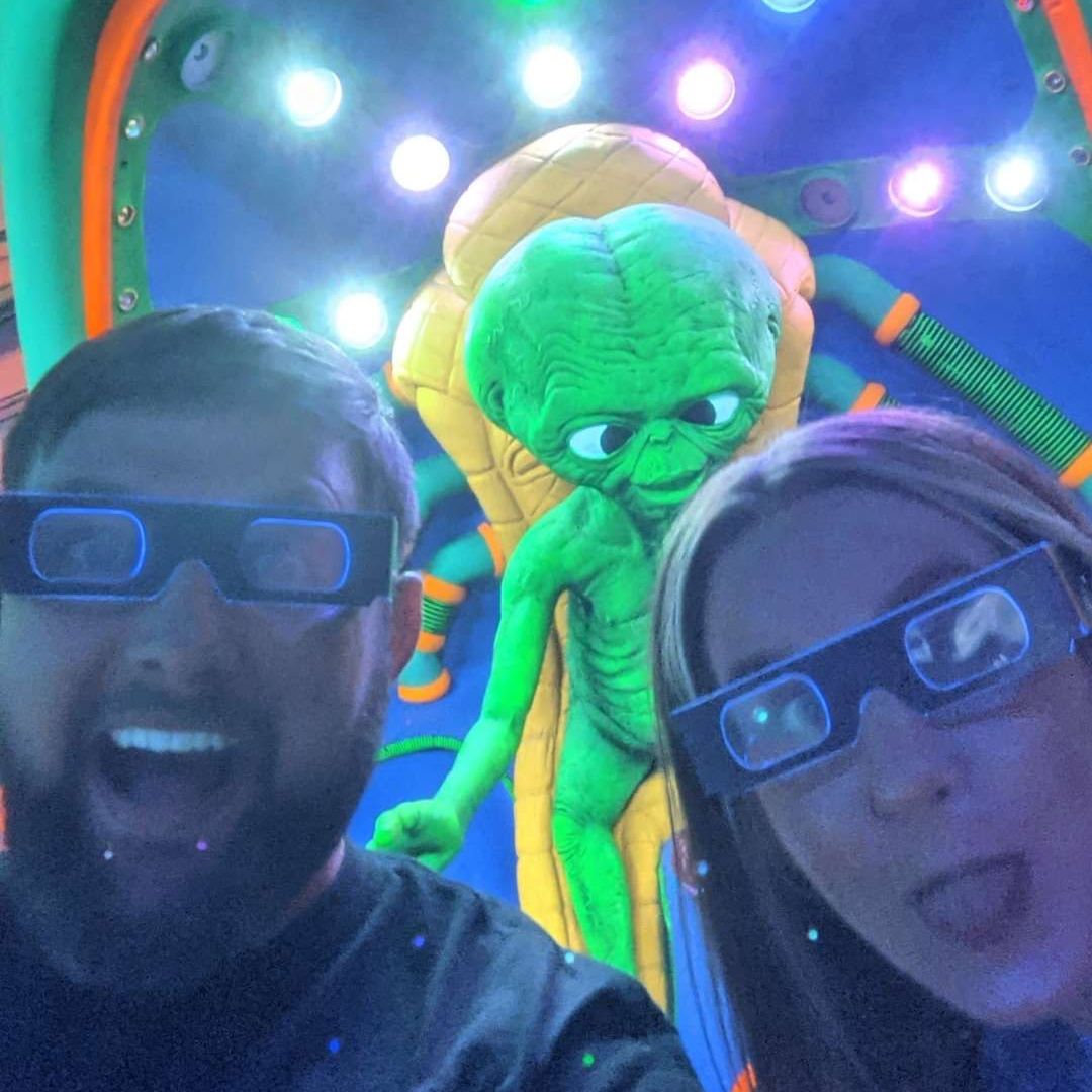 This was our very first date. Eric took Kristen blacklight mini-golfing. And then go-karting.