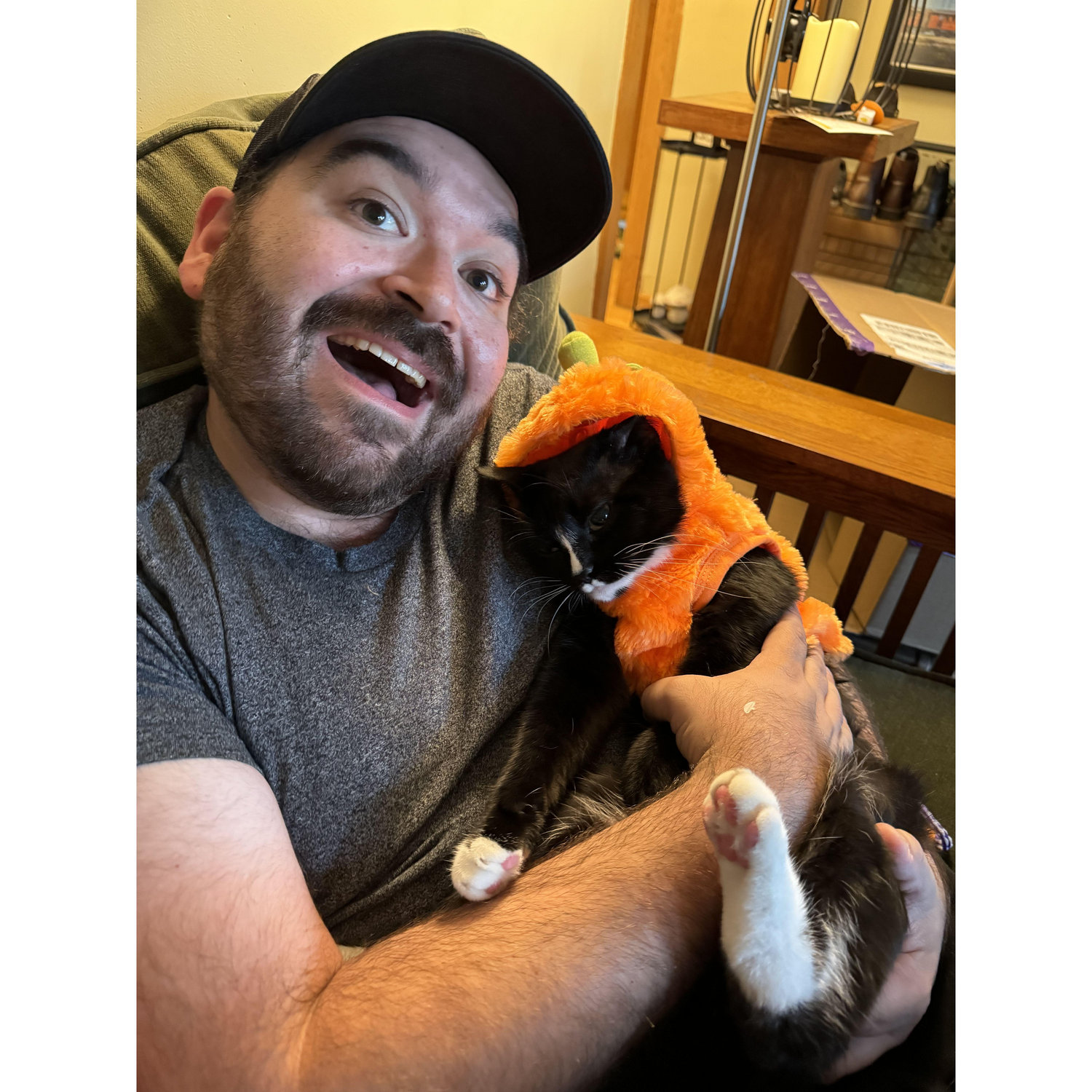 Dressing our kitty boys up despite their protests.