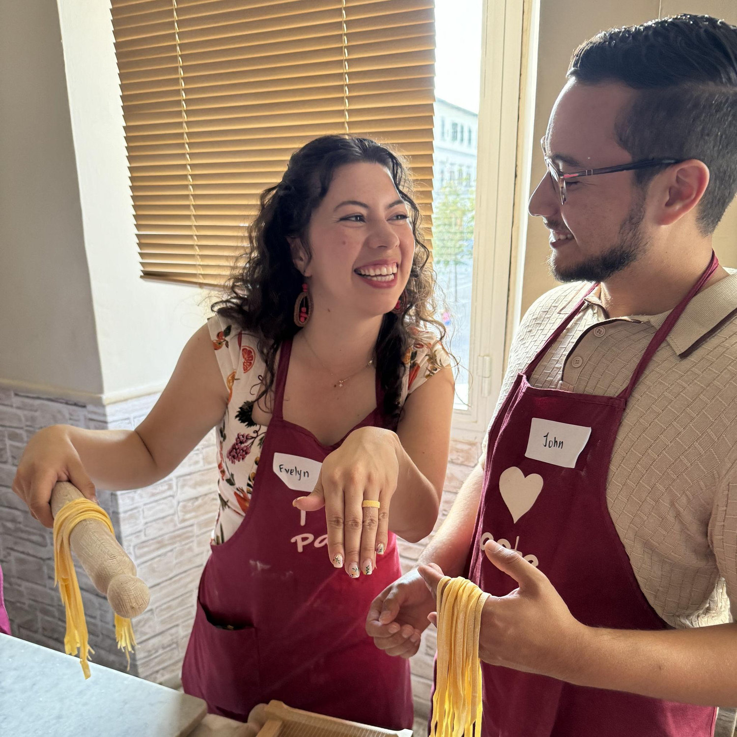 Evelyn and John making homemade pasta in Florence, Italy.