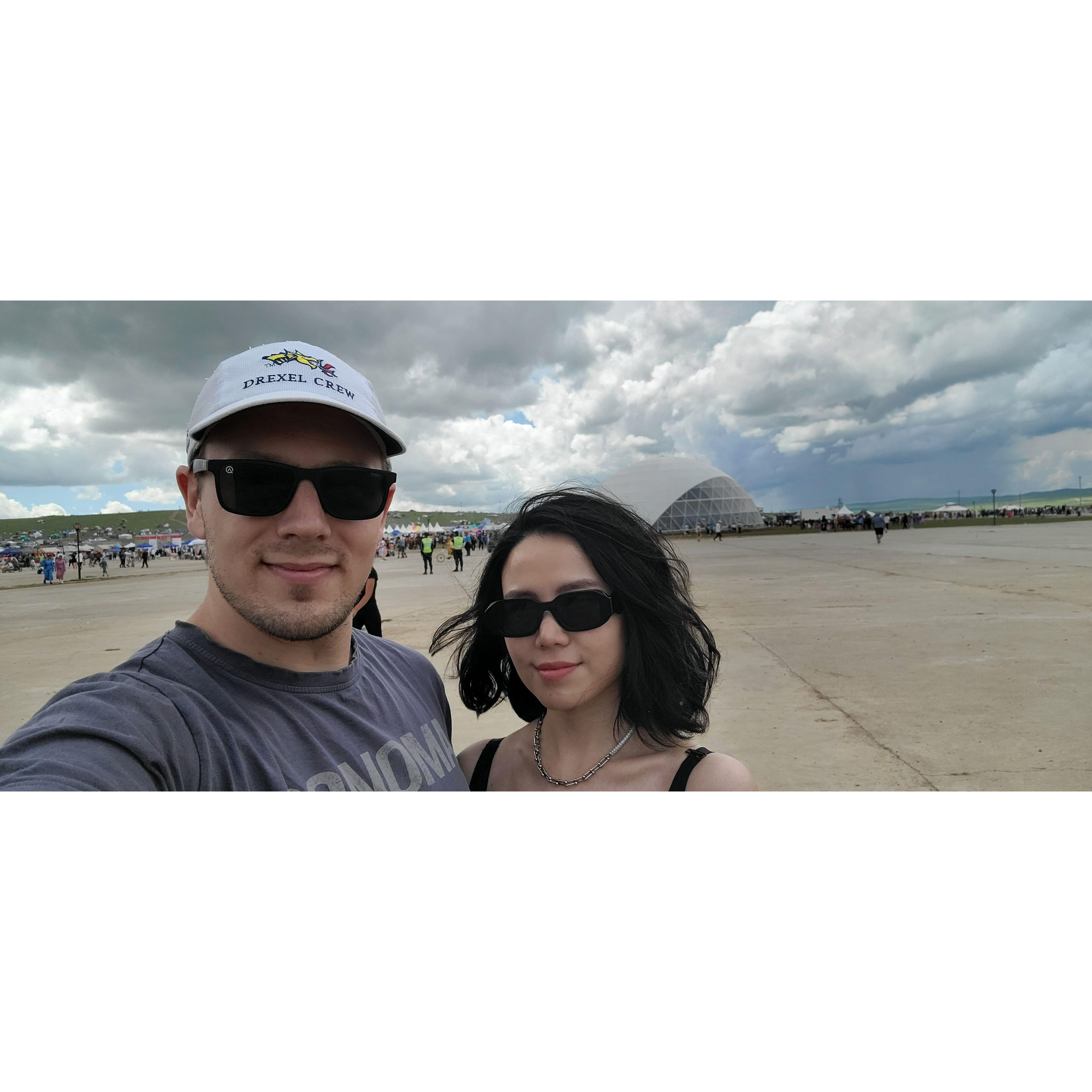 The couple visiting a festival out of the city and in the vast country air of Mongolia. [Aug 2023]