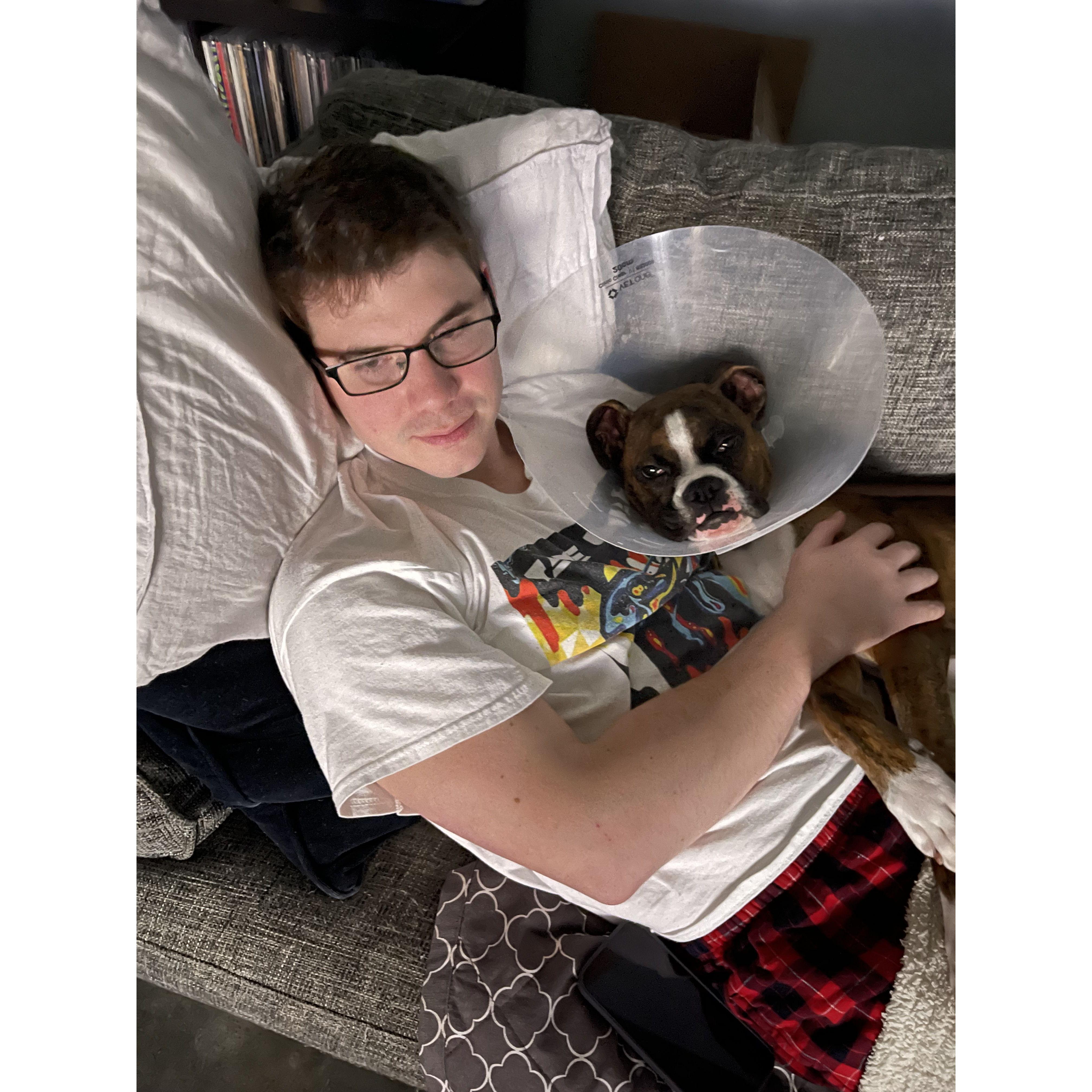 April 2022: Andrew's 30th birthday spent cuddling with Hilde after surgery