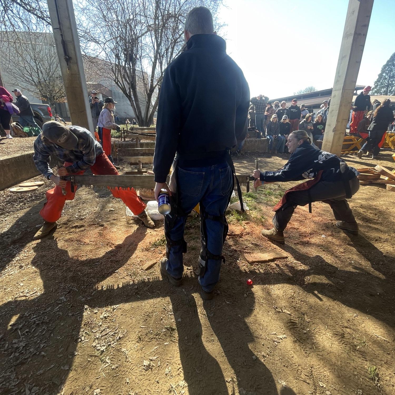 High-school timber sports competition doing crosscut!