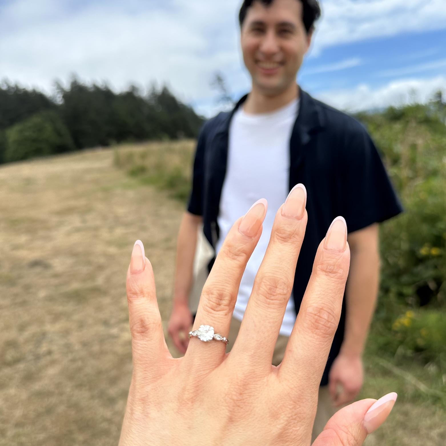 Proposal Day: Admiring the ring. Ashley wanted something old - it's from the 1920s. (July 18th, 2025)