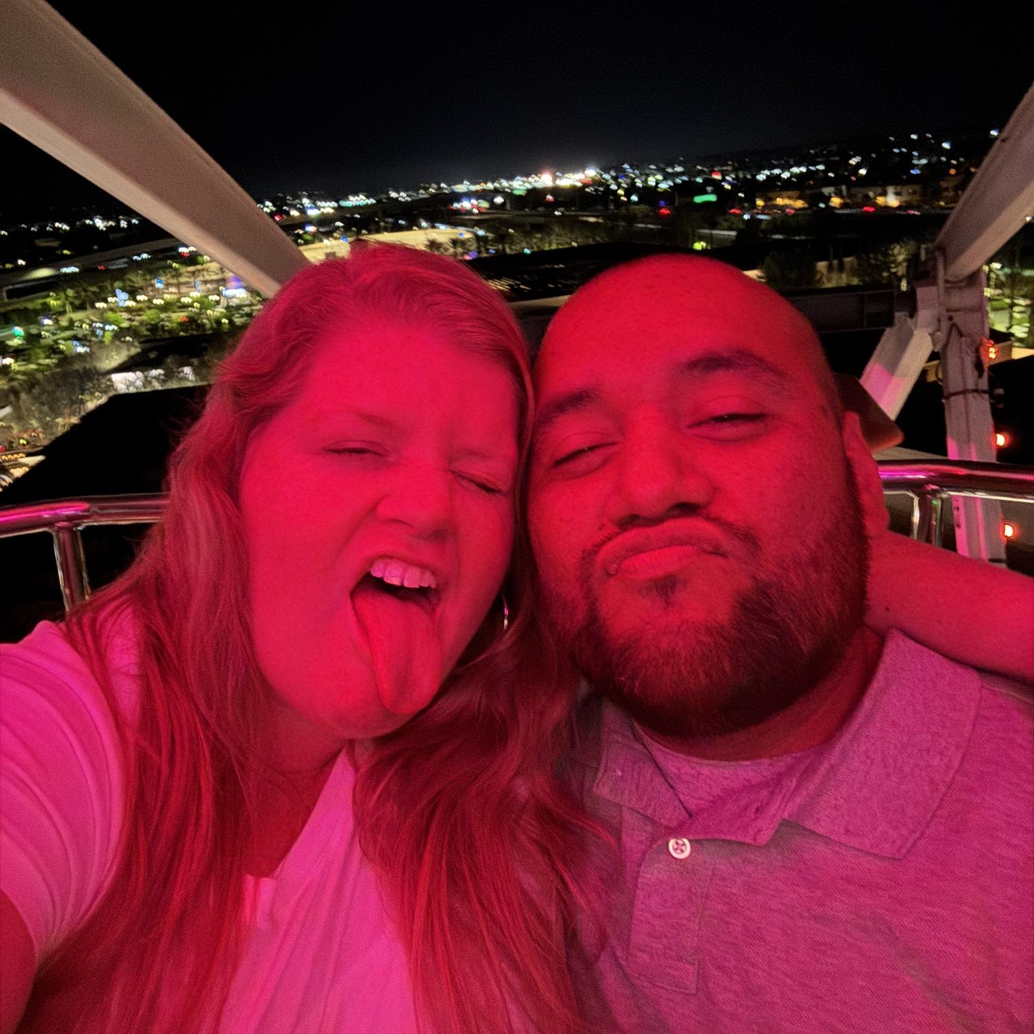 Having a fun time on a ferris wheel and making silly faces!