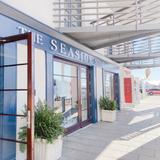 Shop around the Seaside town square for books, clothes, and local art