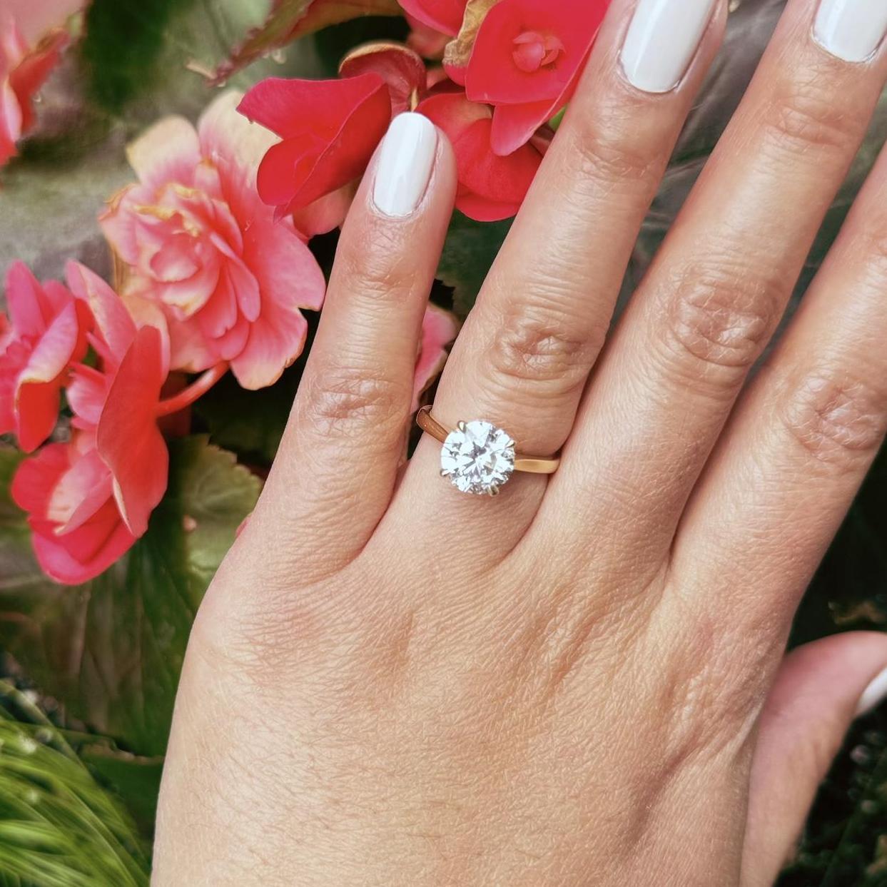 Oh you came here for the details? Lab-grown round diamond, 4 claw prongs, gallery rail, cathedral setting. Thank you, Bohdan!