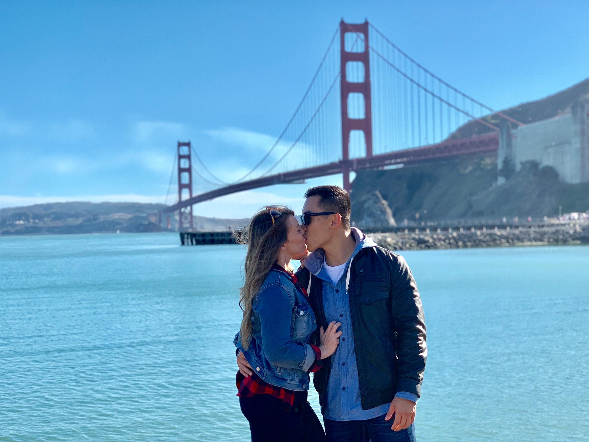 Our first trip to San Francisco smooching under the golden gate bridge