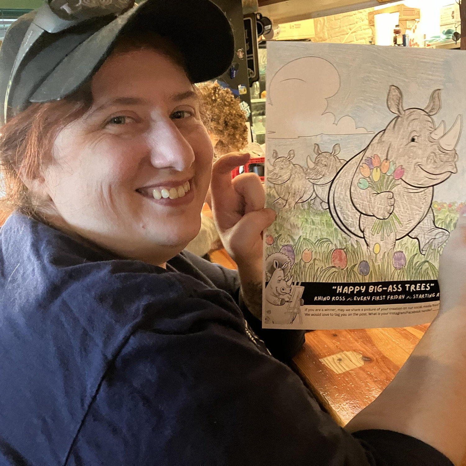 Stacie and the rhino she colored at The Rhino.