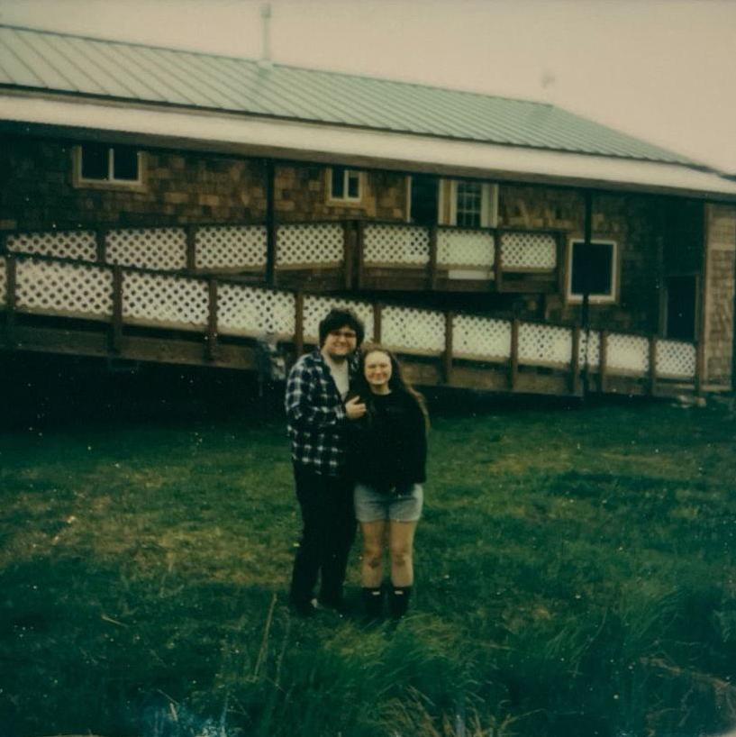 Polaroid shot of us in front of our new home in Nikolaevsk