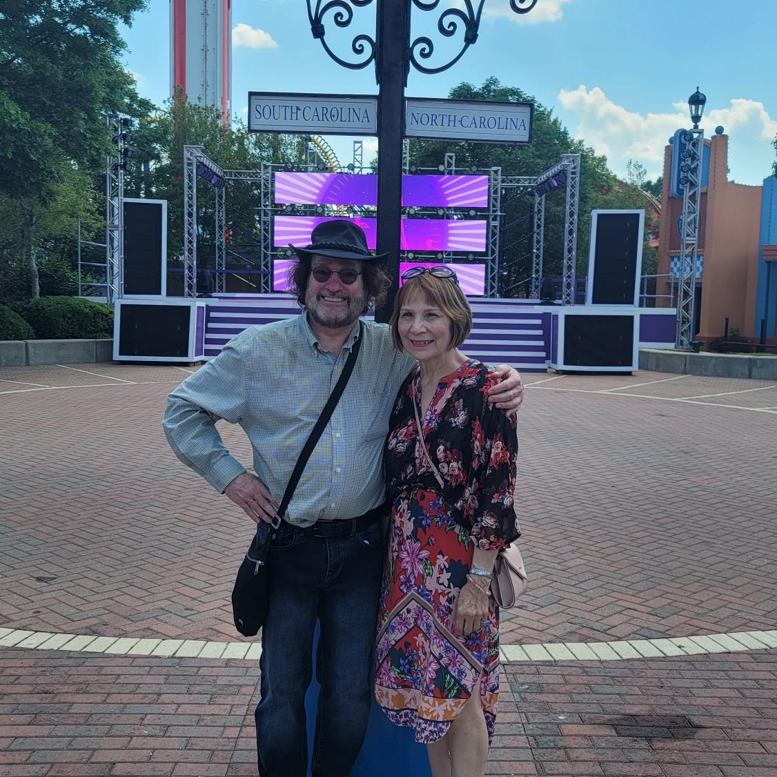 Standing next to each other in two different states at Carowinds.