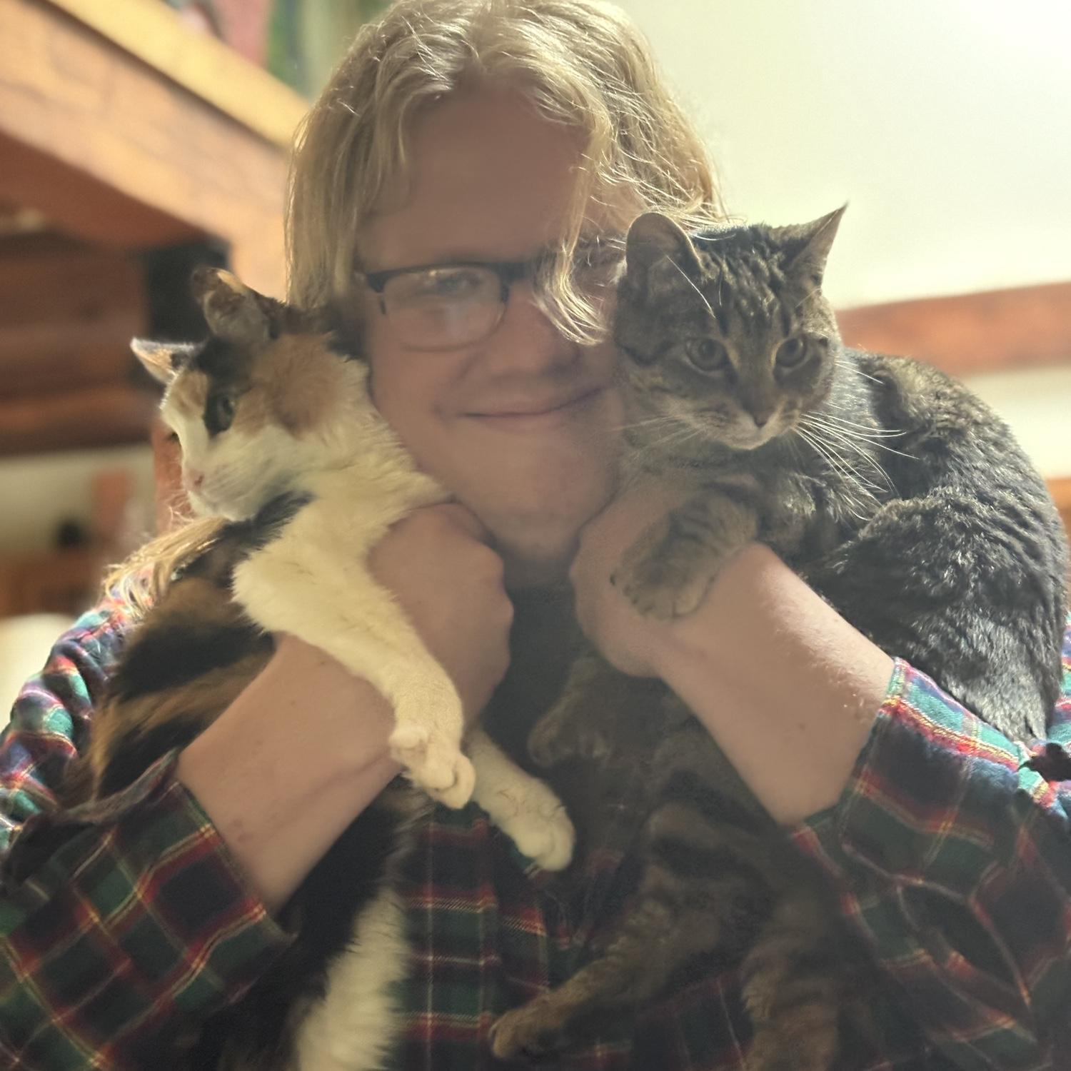 Connor posing with our furry friends Uri (Mus Mus) and Beans!
(May 2025)