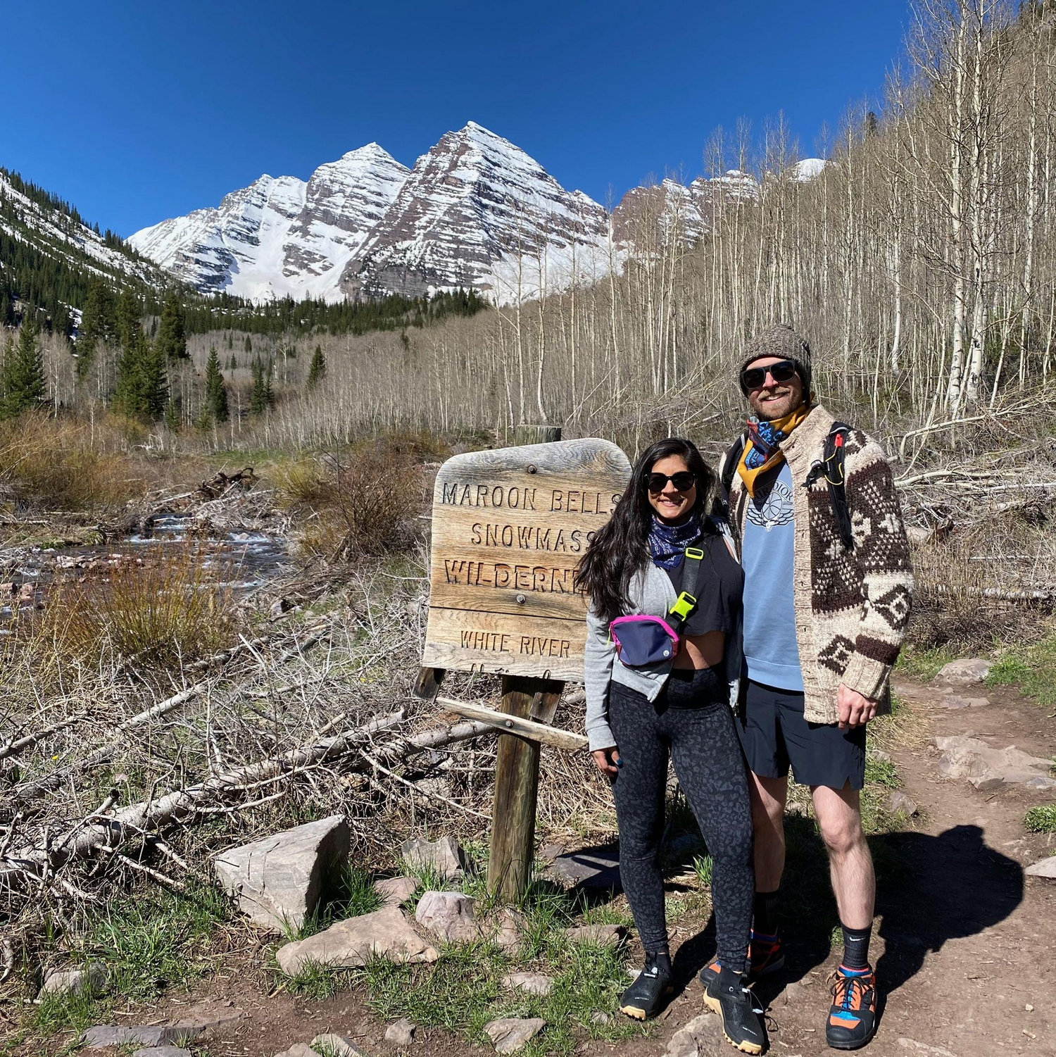Maroon Bells in Colorado, the most photographed mountains in the US. One of us thought to wear something funky for the hike, and one of us didn't.