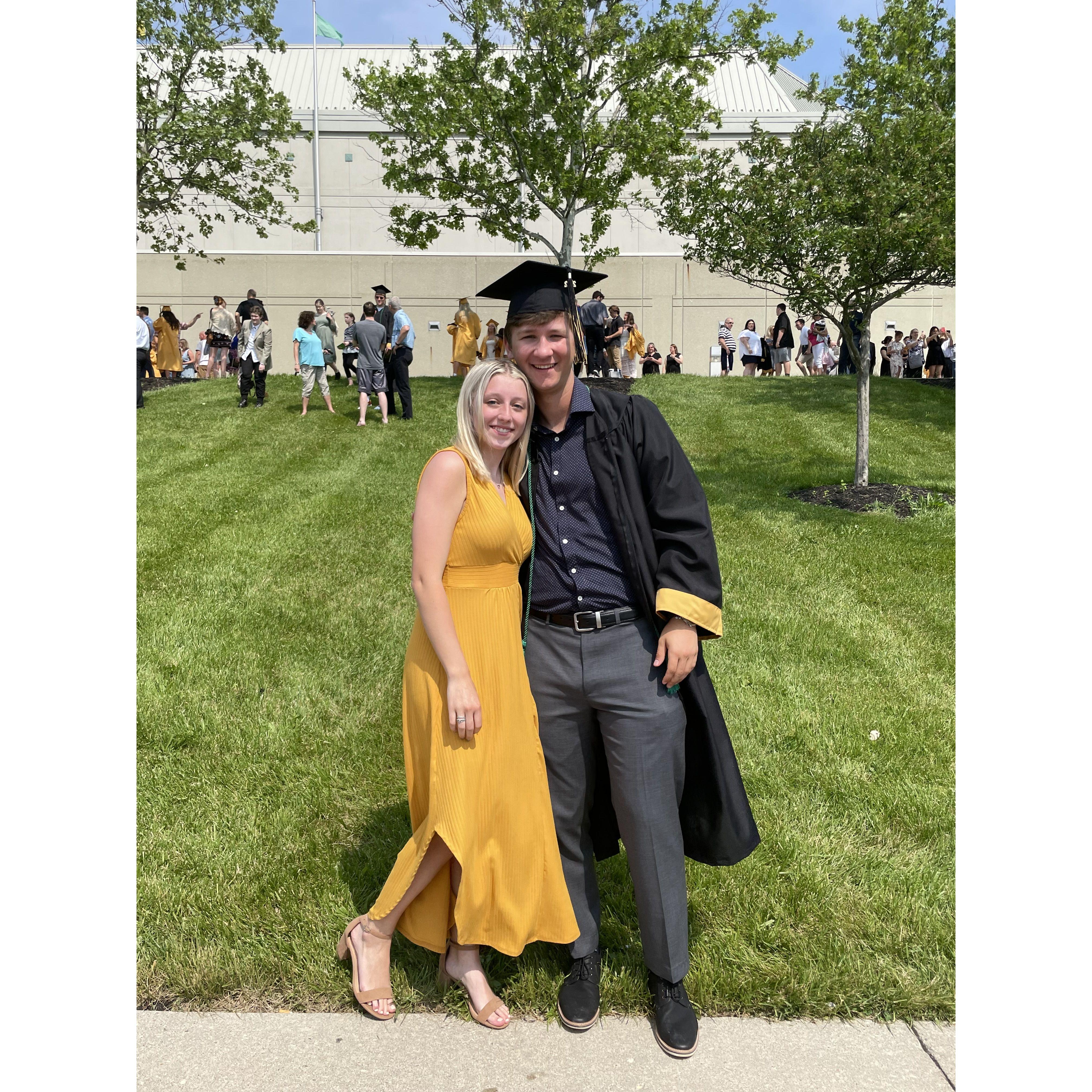 Paige cheering on Noah at his High School graduation in 2022