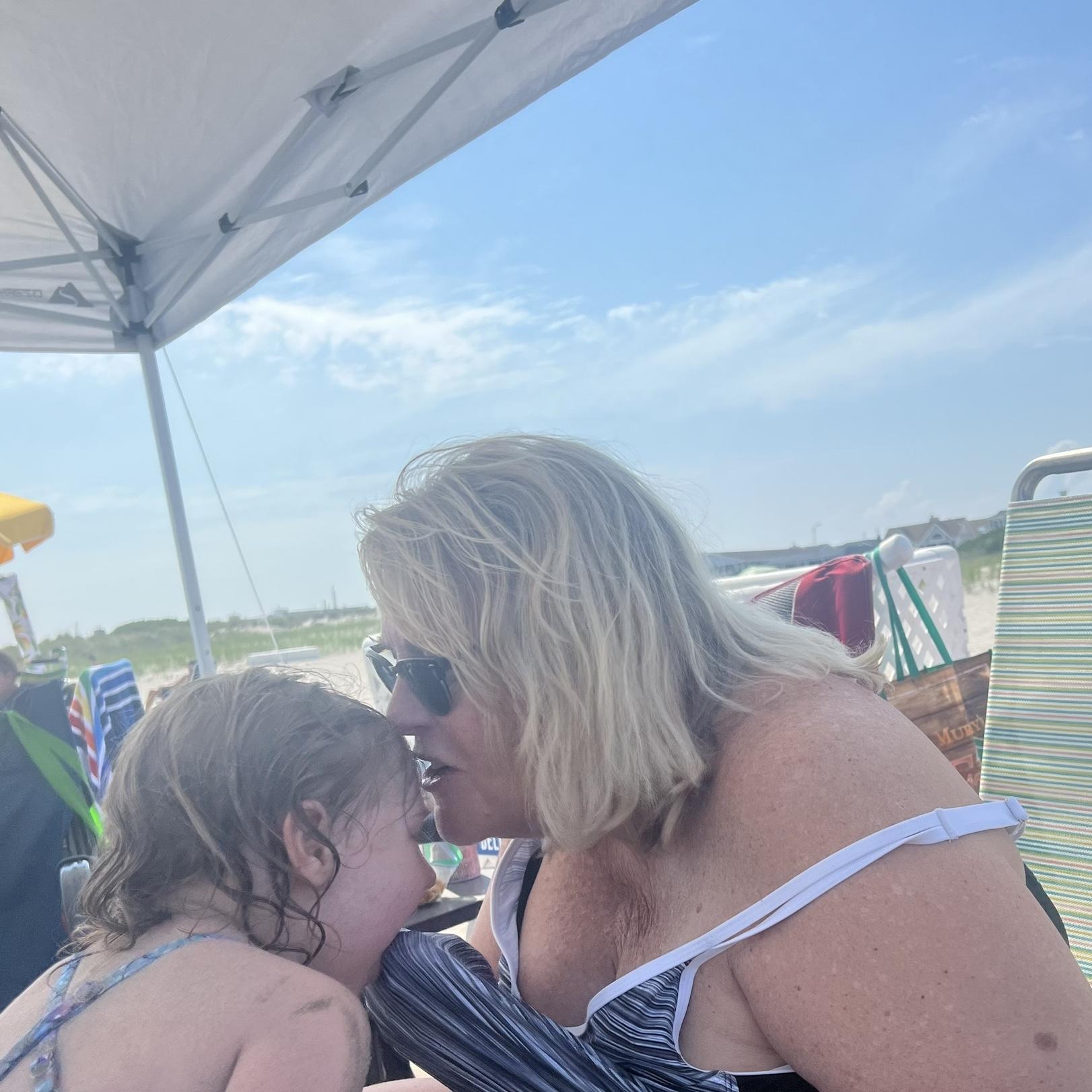 Marlowe swallowed a lot of sand, Gram to the rescue!