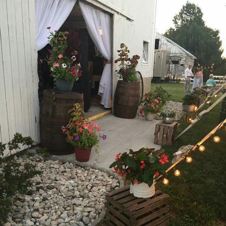 Outdoors between barn and tent