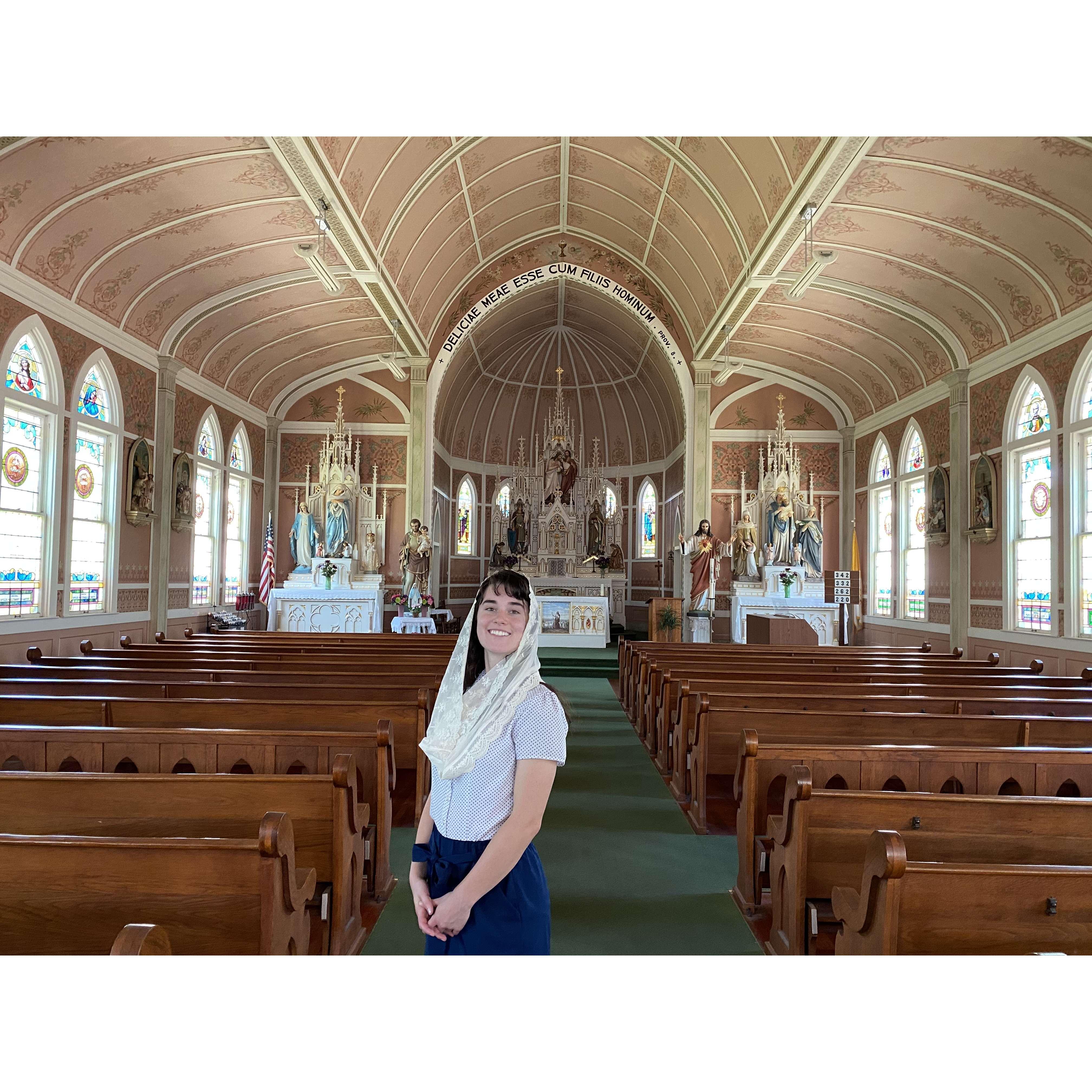 Probably about 20 minutes before he proposed, Nathan snapped this pic of me in St. John the Baptist's in Ammannsville, TX. He proposed in front of the prayer candles by the American flag on the left.