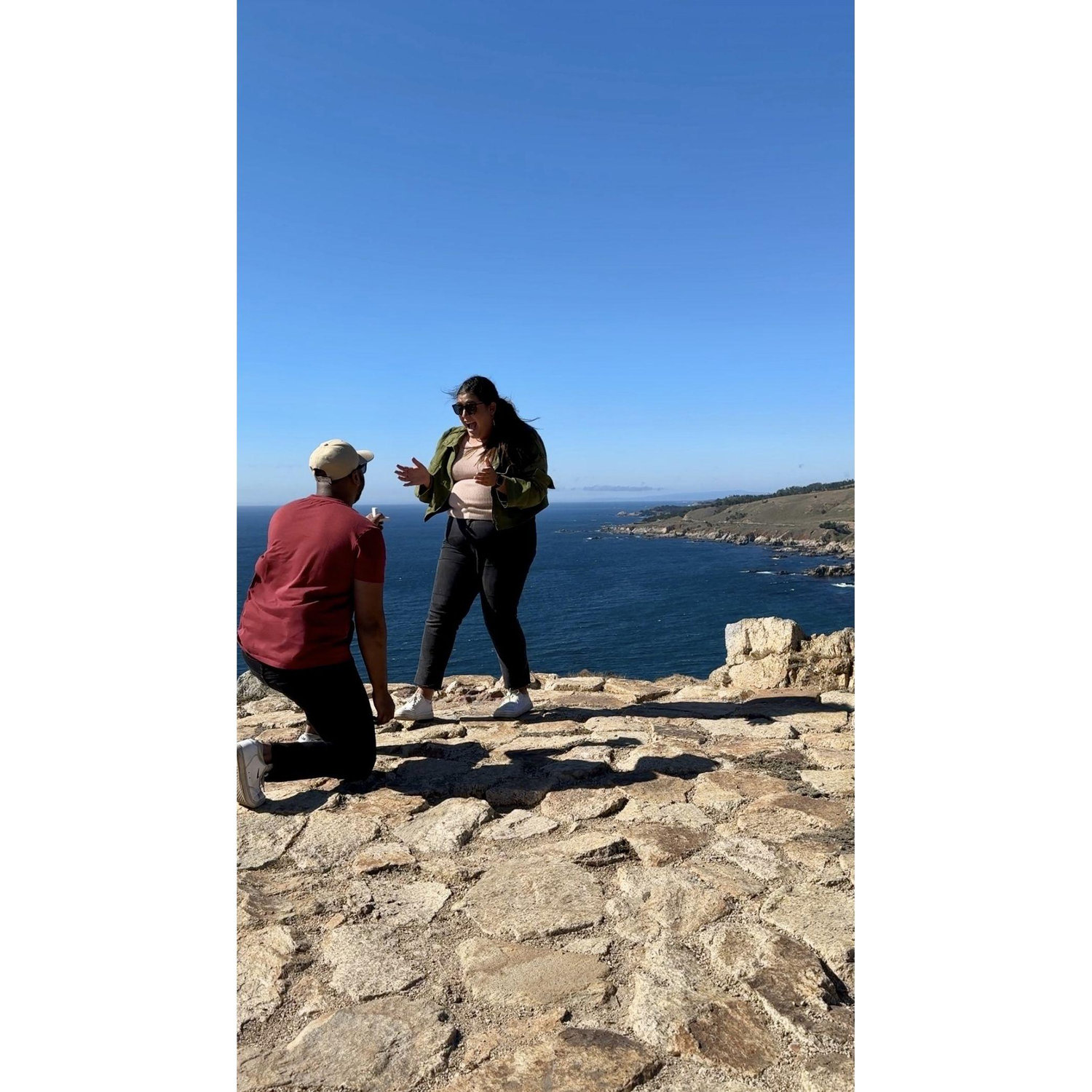 Ashish proposed on September 2, 2024 in Big Sur. We took a walk to the most gorgeous overlook in the area. The wind was present, but so was the sun. Elizabeth was completely shocked when he asked!