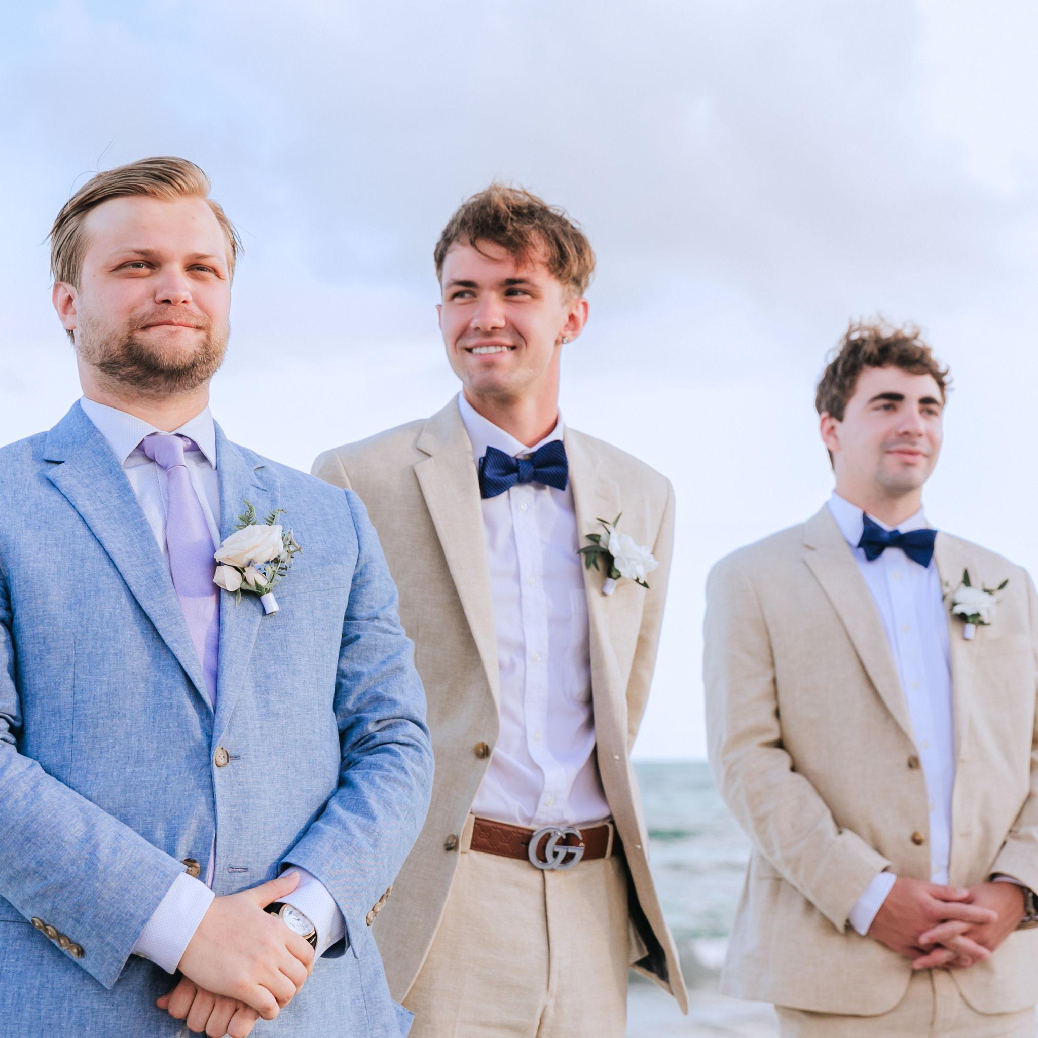 Henry's brother Peter, Katie's brother Carson, and Henry's friend Jered stood beside him at the altar.
