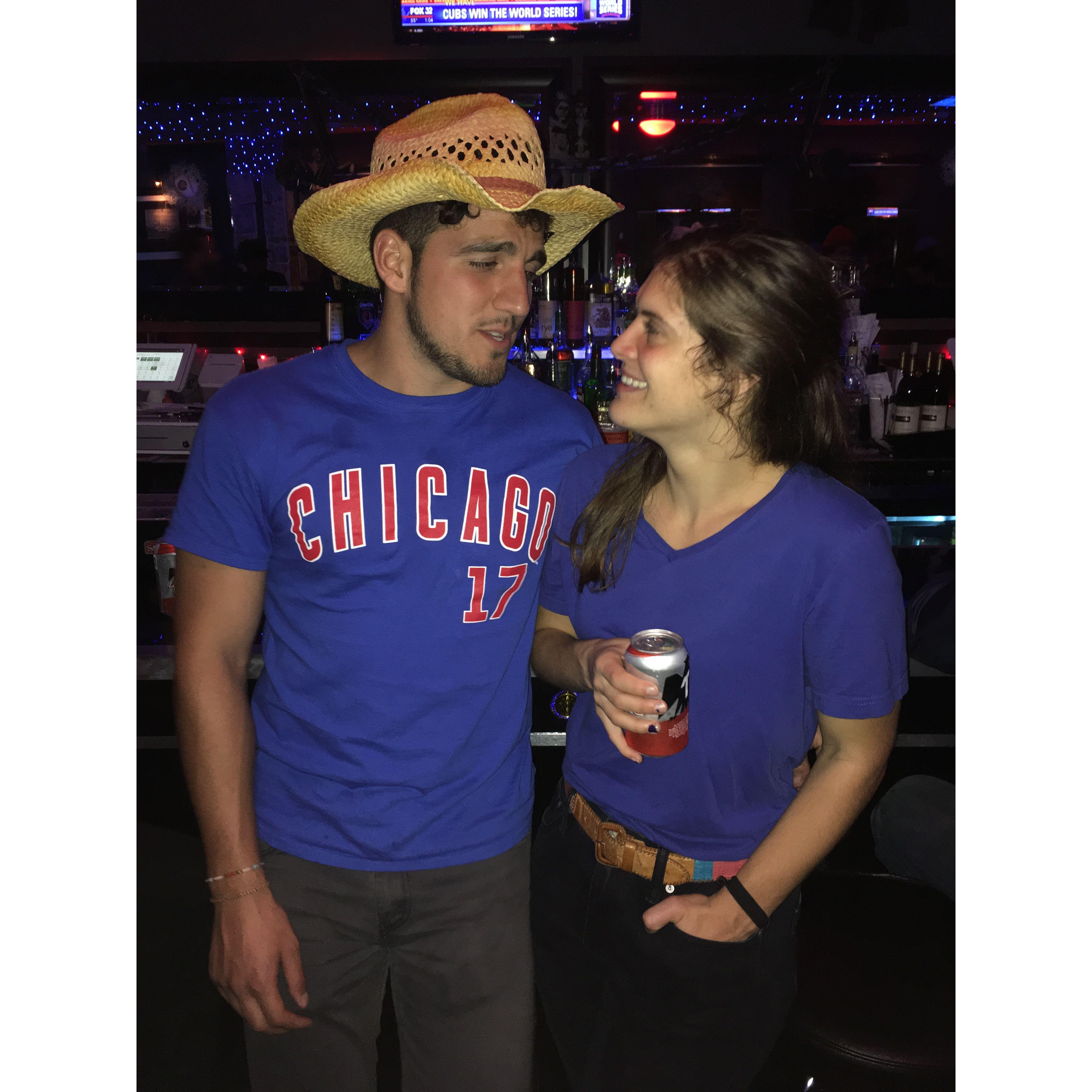 Out on the town when the Cubs pulled off the World Series victory. 

Andrea had no Cubs clothes on hand at the time, thus she's wearing Martín's ill-fitting clothes.