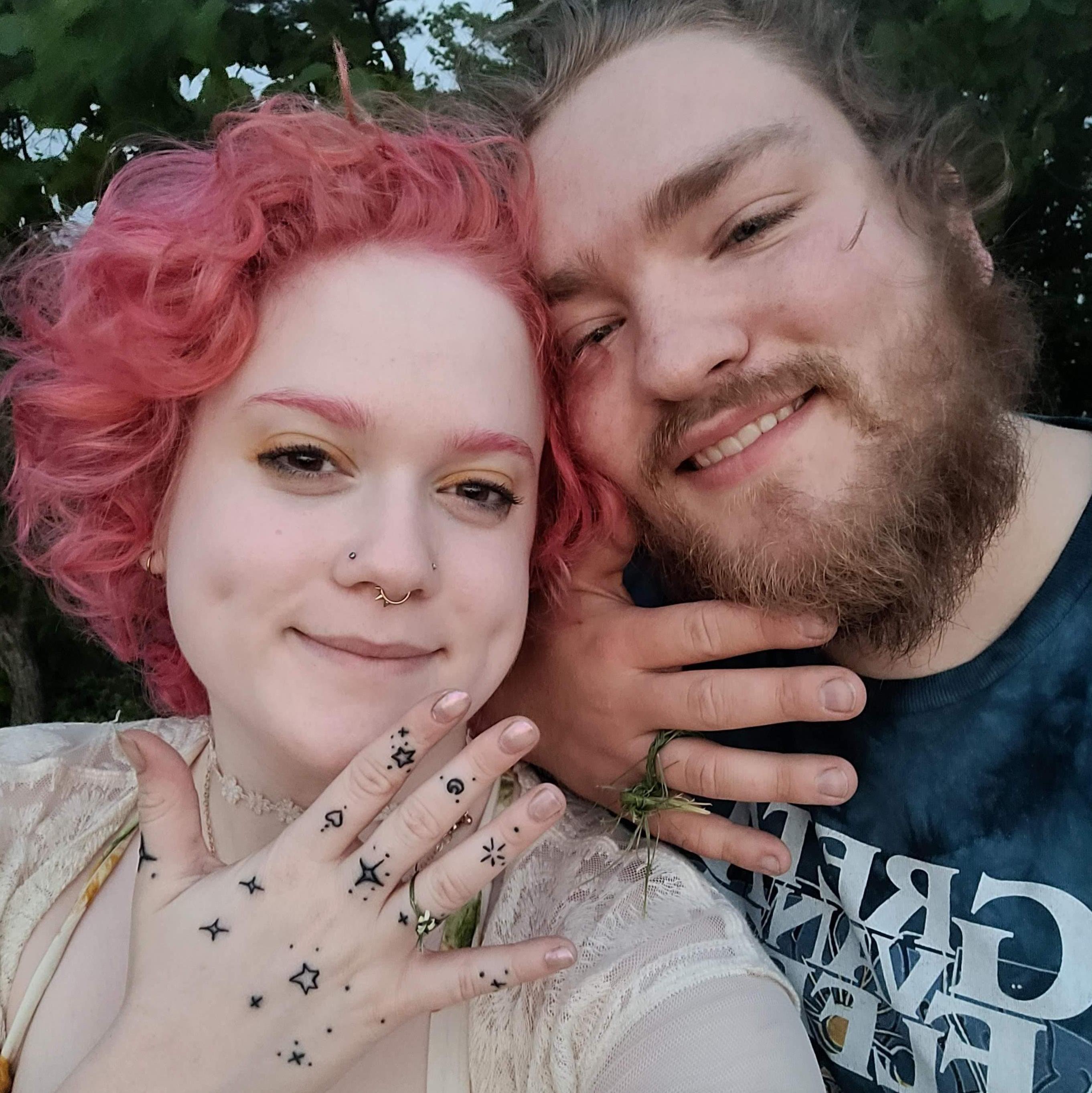 Showing off our grass rings that we made for each other when Cazi proposed