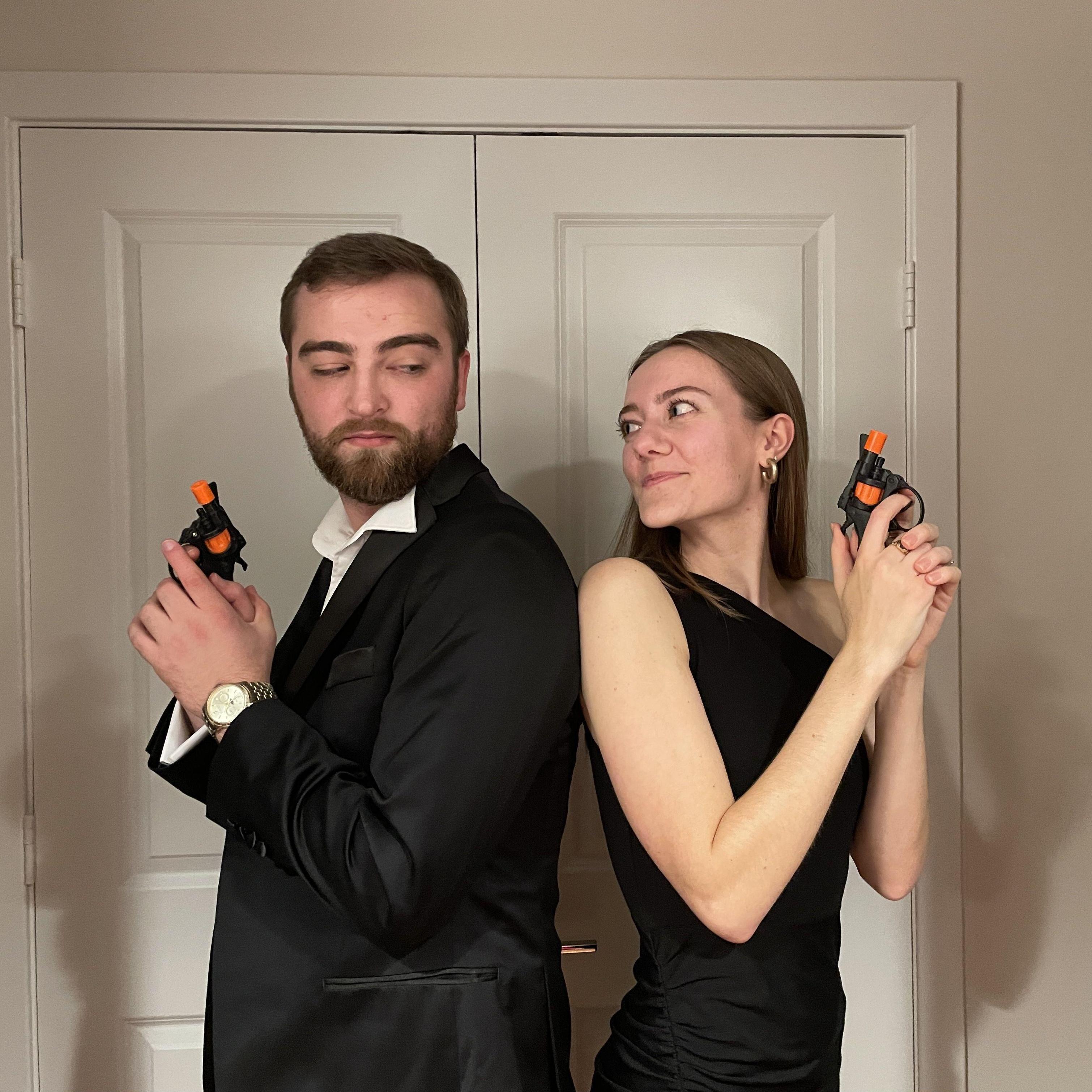 Halloween 2022 dressed as Mr. and Mrs. Smith.