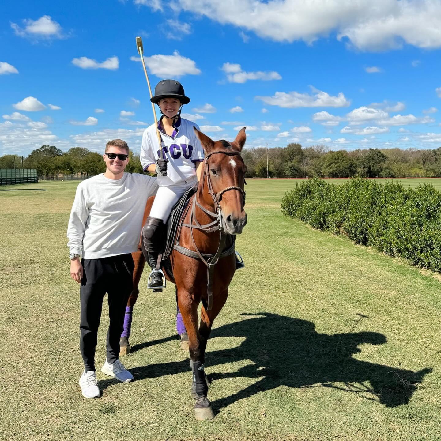 Mike being the best cheerleader as Katie played in an alumni match with her college polo team!