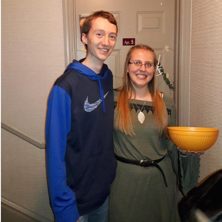 Janice and Sam hand out candy for Halloween at Calvin's Light in the Night