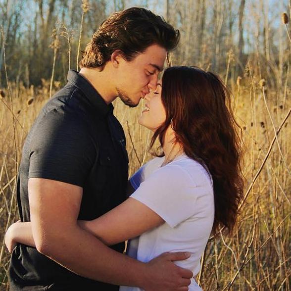 Swapping cooties during AJ's senior year photoshoot. :)