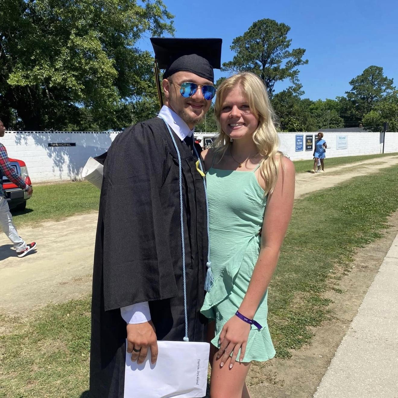 Darren and Ava at Darren's high school graduation.