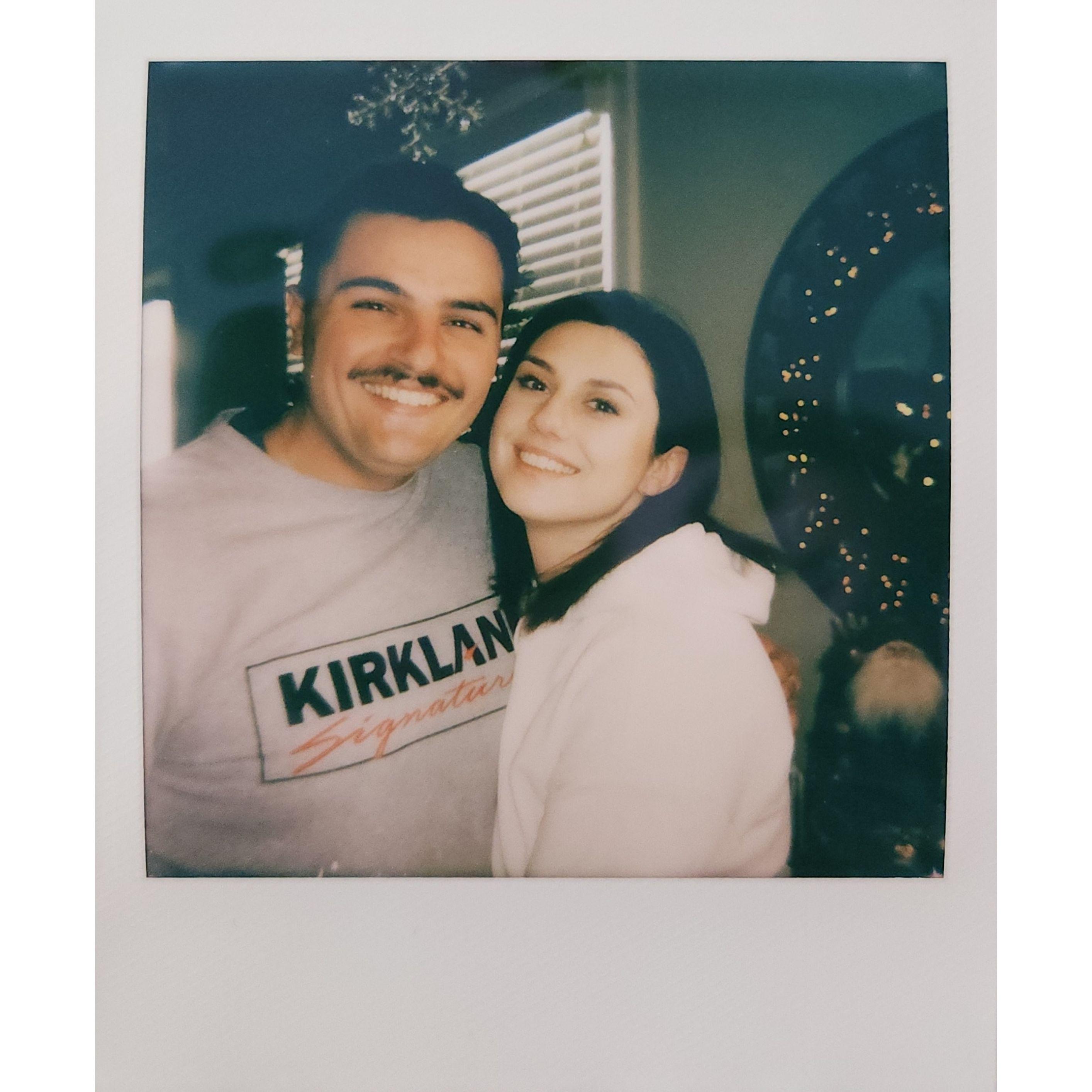 Our first Christmas together! Elizabeth bought Nick a polaroid camera to take pictures of her as his Christmas present.