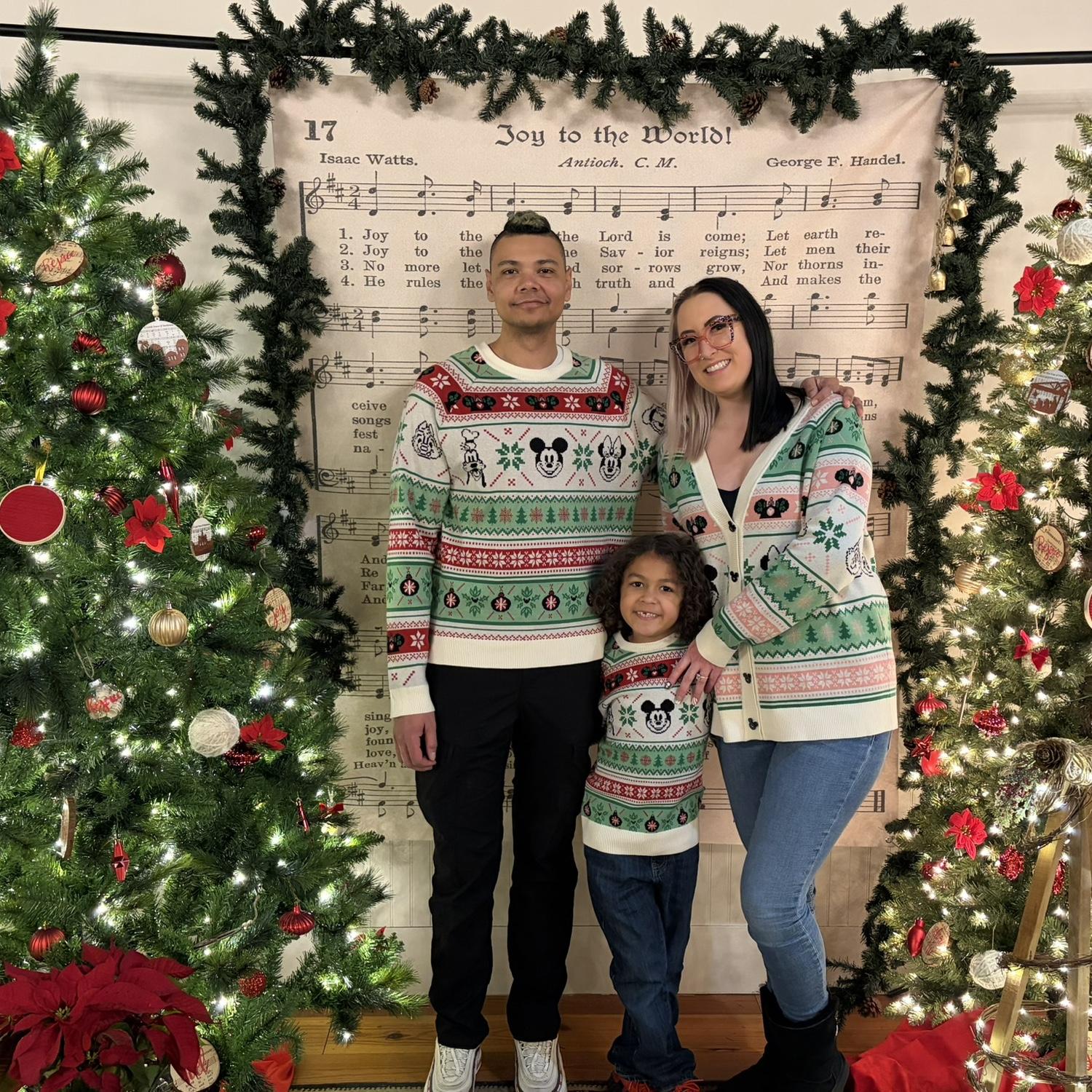 Family picture at a holiday event for Christmas in Youngsville🎄🎅🏼