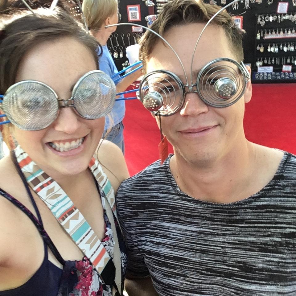 Our very first photo together! This was sampling the wares on sale at Boise’s annual Art in the Park Festival.