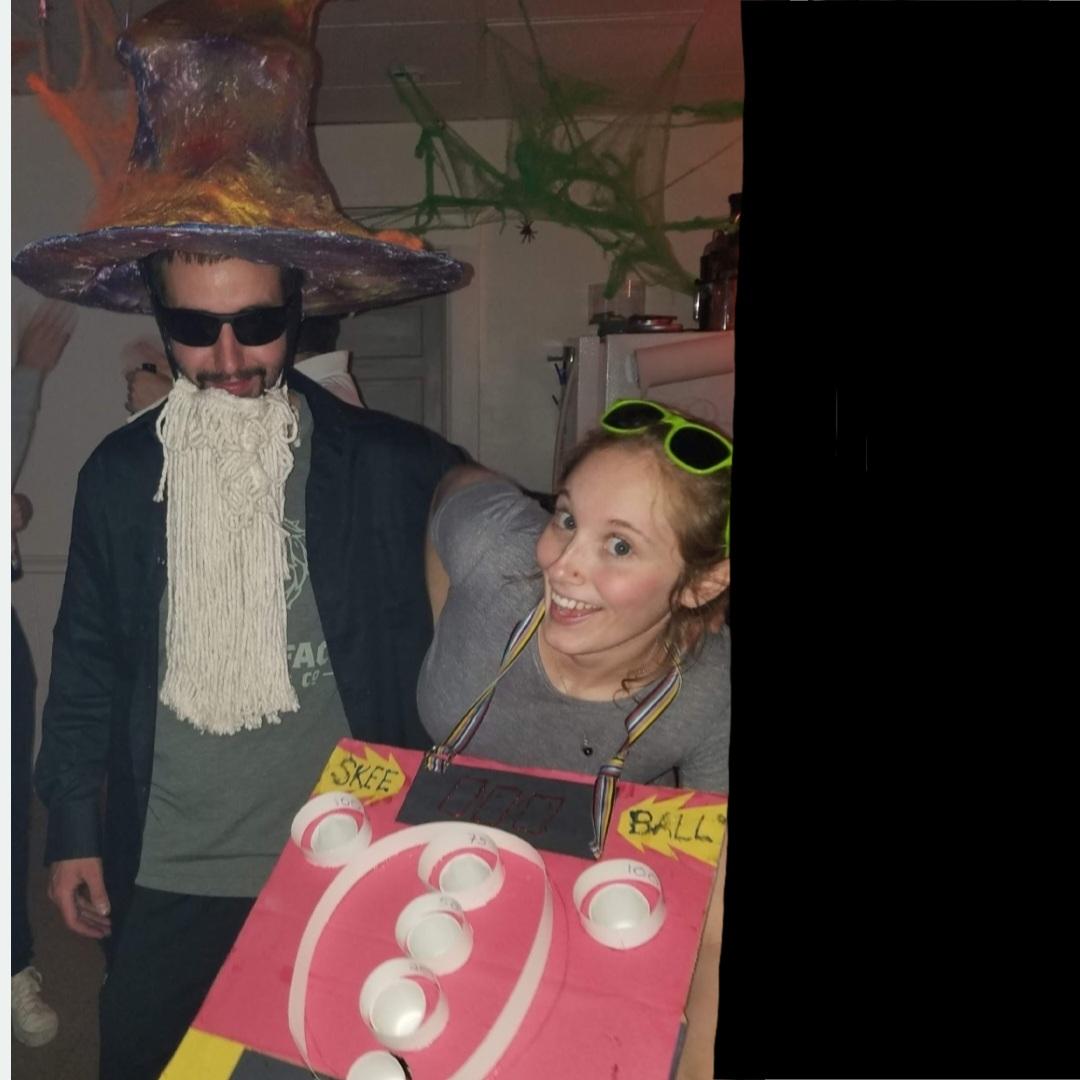 Halloween Party 2018 - Dave is a wizard with a 12-lb, homemade hat and mop beard; Lizzie is a skeeball machine!