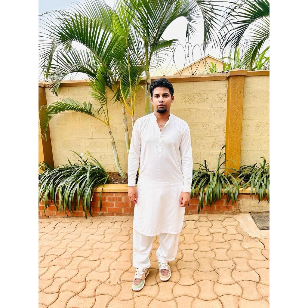 The Groom in traditional Pakistani wear.  The Bride thinks this is one of his sexiest photos! ;)