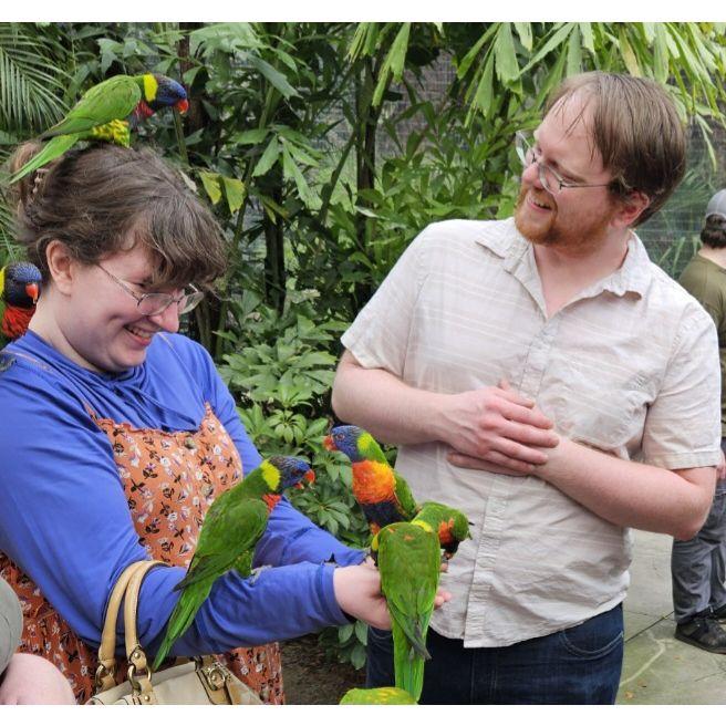 In Florida at a zoo playing with some parrots. They seemed to really like perching on Ashley.