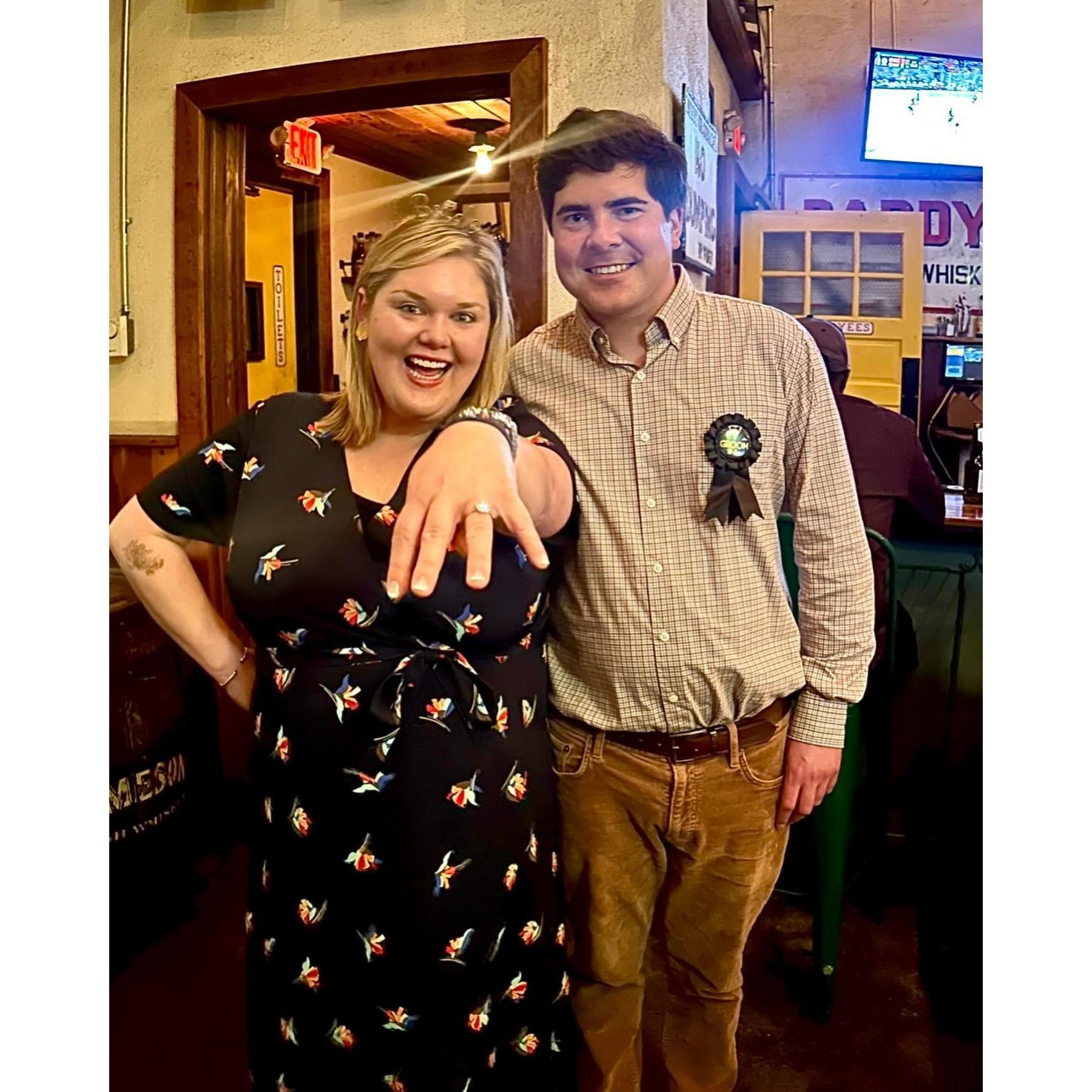 Celebrating the night of our engagement with friends at a surprise party at Workman's Friend