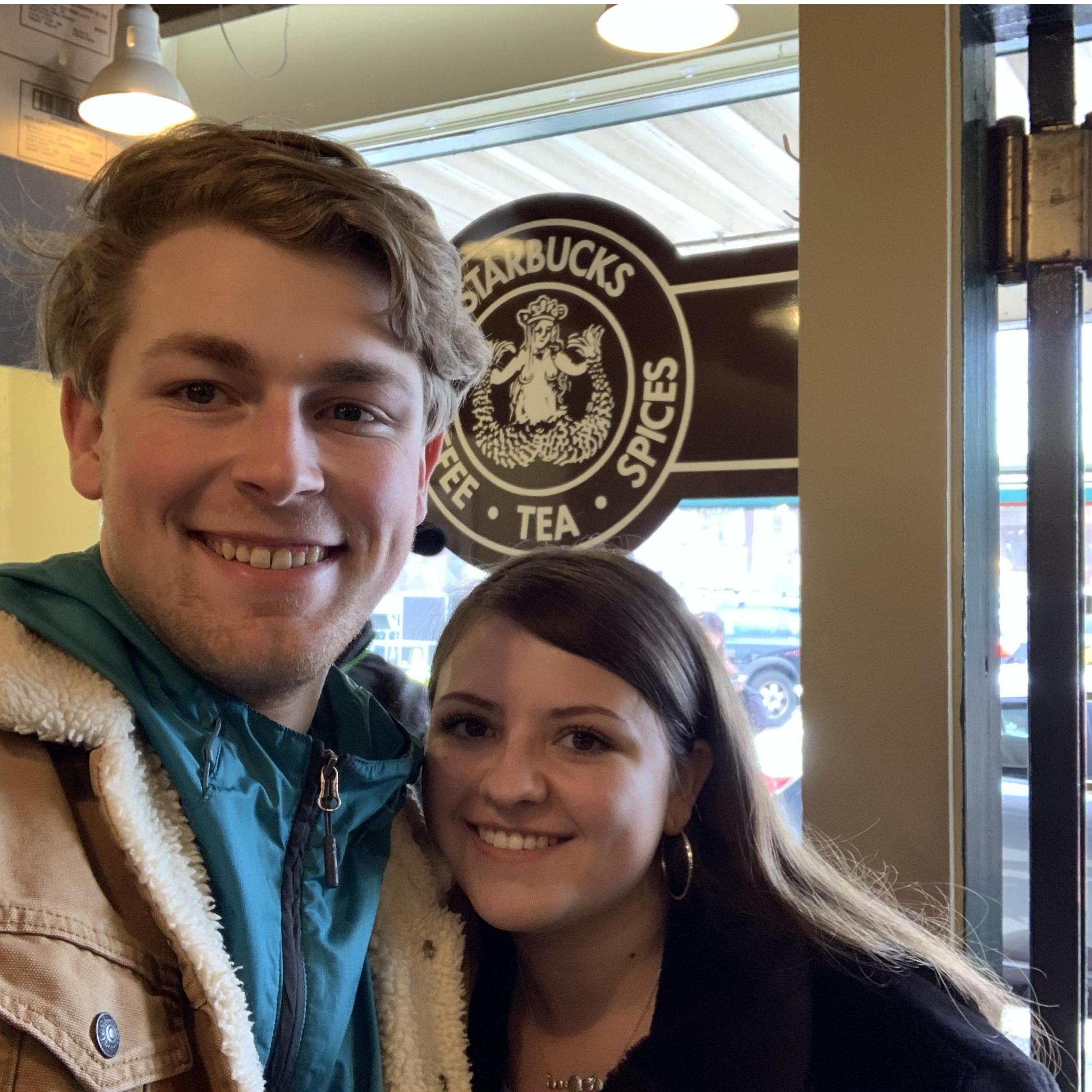 Getting coffee at the very first Starbucks at Pikes Place Market in Seattle, Washington.